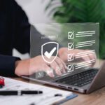 Car Dealer Businessman Use Laptop,checklist And Signing Car Insu
