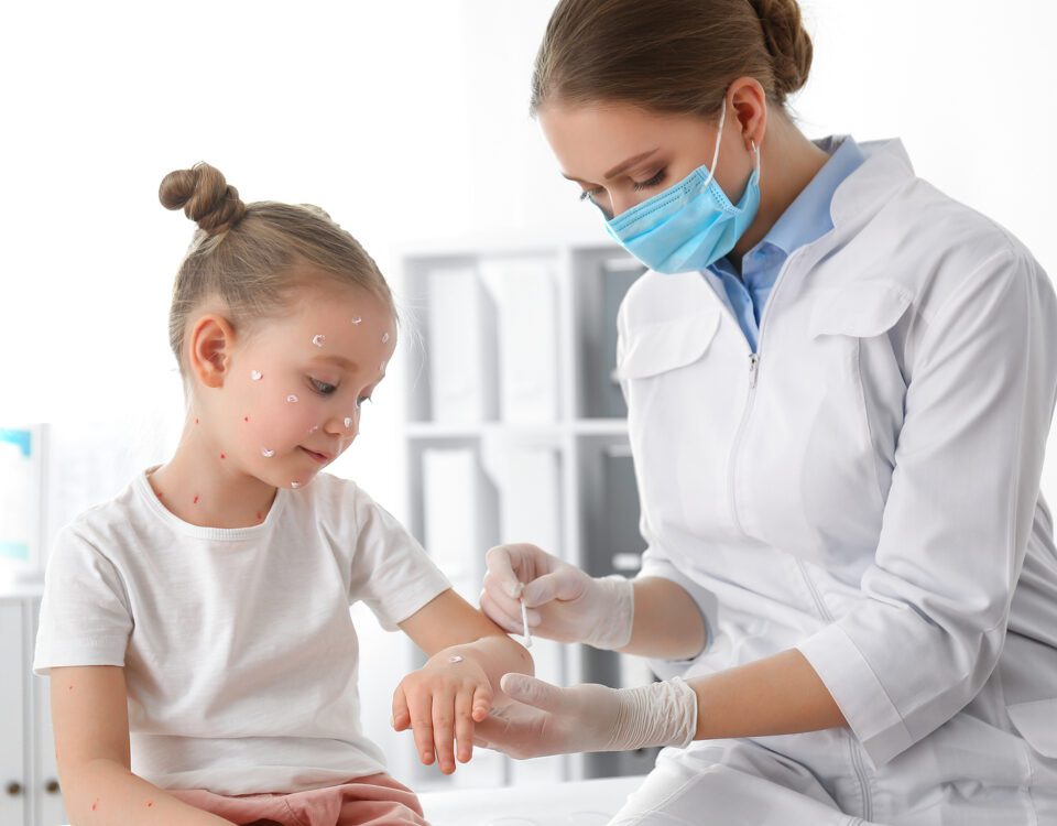 Doctor Applying Cream Onto Skin Of Little Girl With Chickenpox I